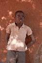 Boy Pink Shirt (800Wx1200H) - Boy in Pink Shirt at Wall - Zambia - 2010 