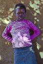 Girl Purple Sweater (800Wx1200H) - Girl in Purple Sweater at Wall - Zambian Village - 2010 